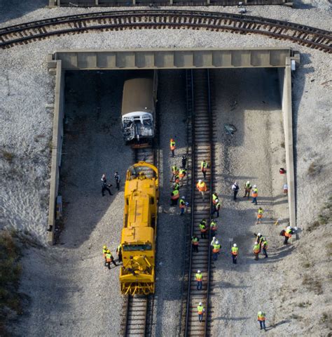 Two dozen taken to hospitals after commuter train crashes into snow plow in Chicago